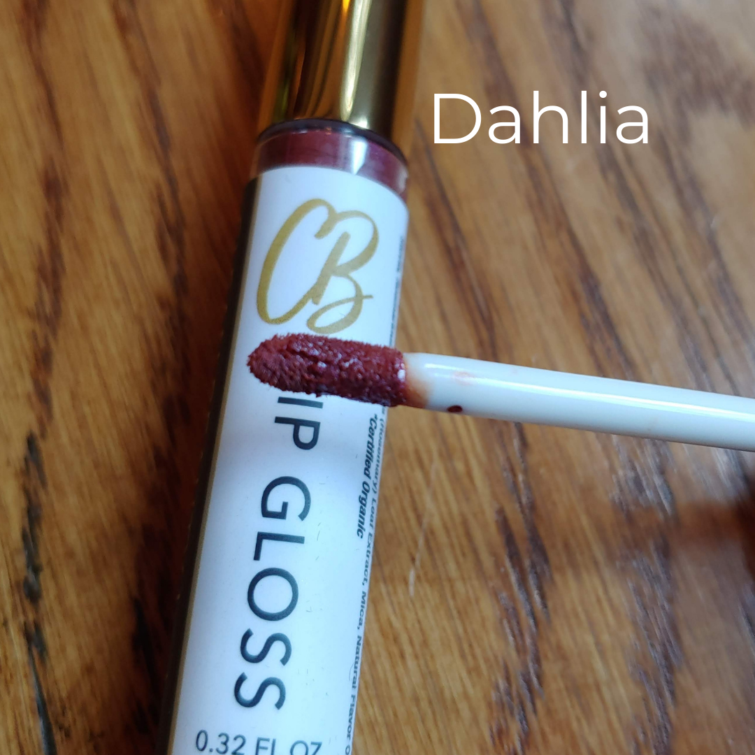 Dahlia Perfect Pout Lip Gloss by Clean Beauty by joy. This creamy formula is long-lasting, moisturizing, and made with truly safe ingredients. The organic, vegan, gluten free ingredients are high-performing and are not sticky or tacky. Clean and safe makeup.